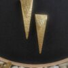 sealed trikon earrings