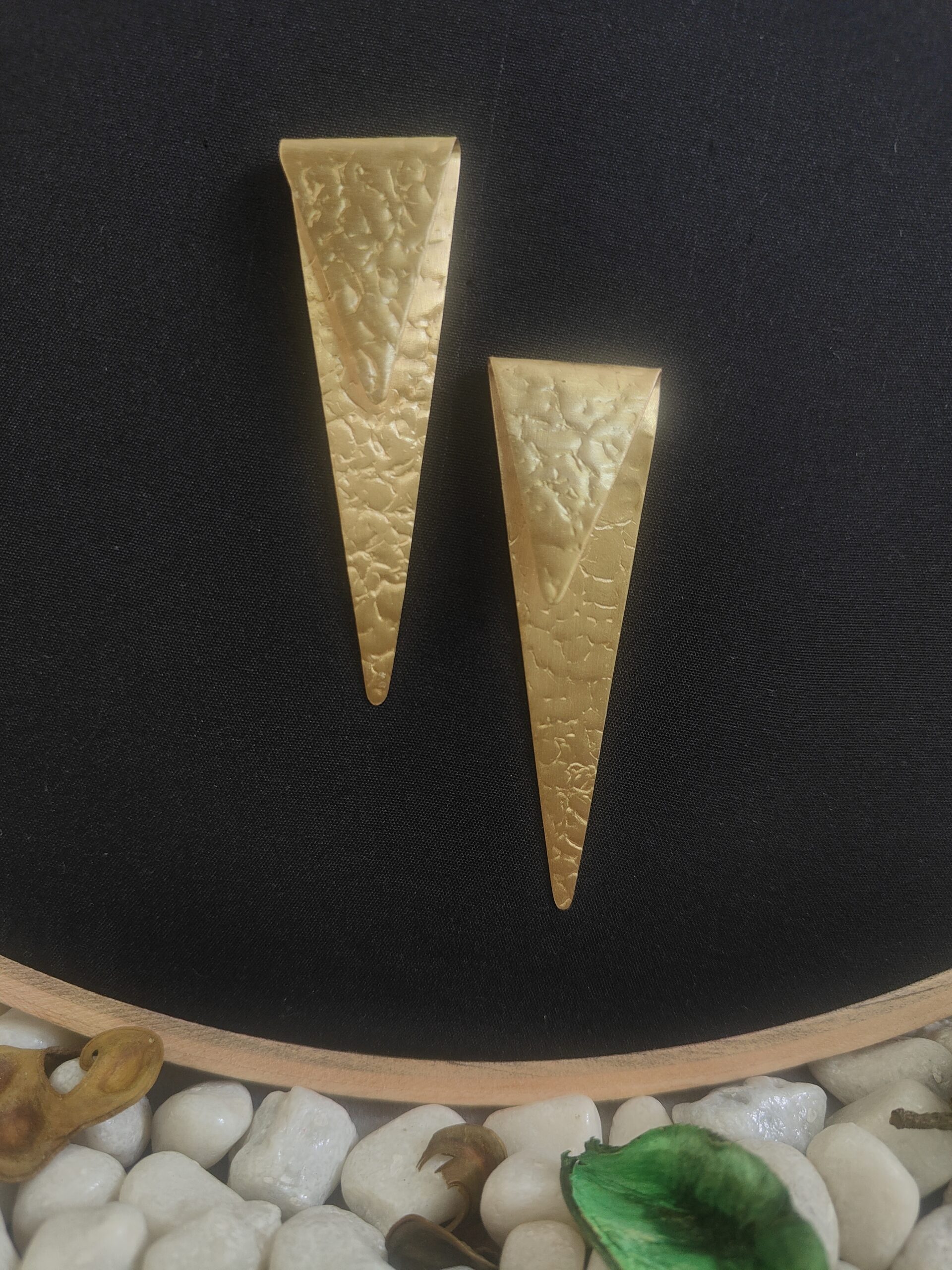 sealed trikon earrings