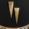 sealed trikon earrings