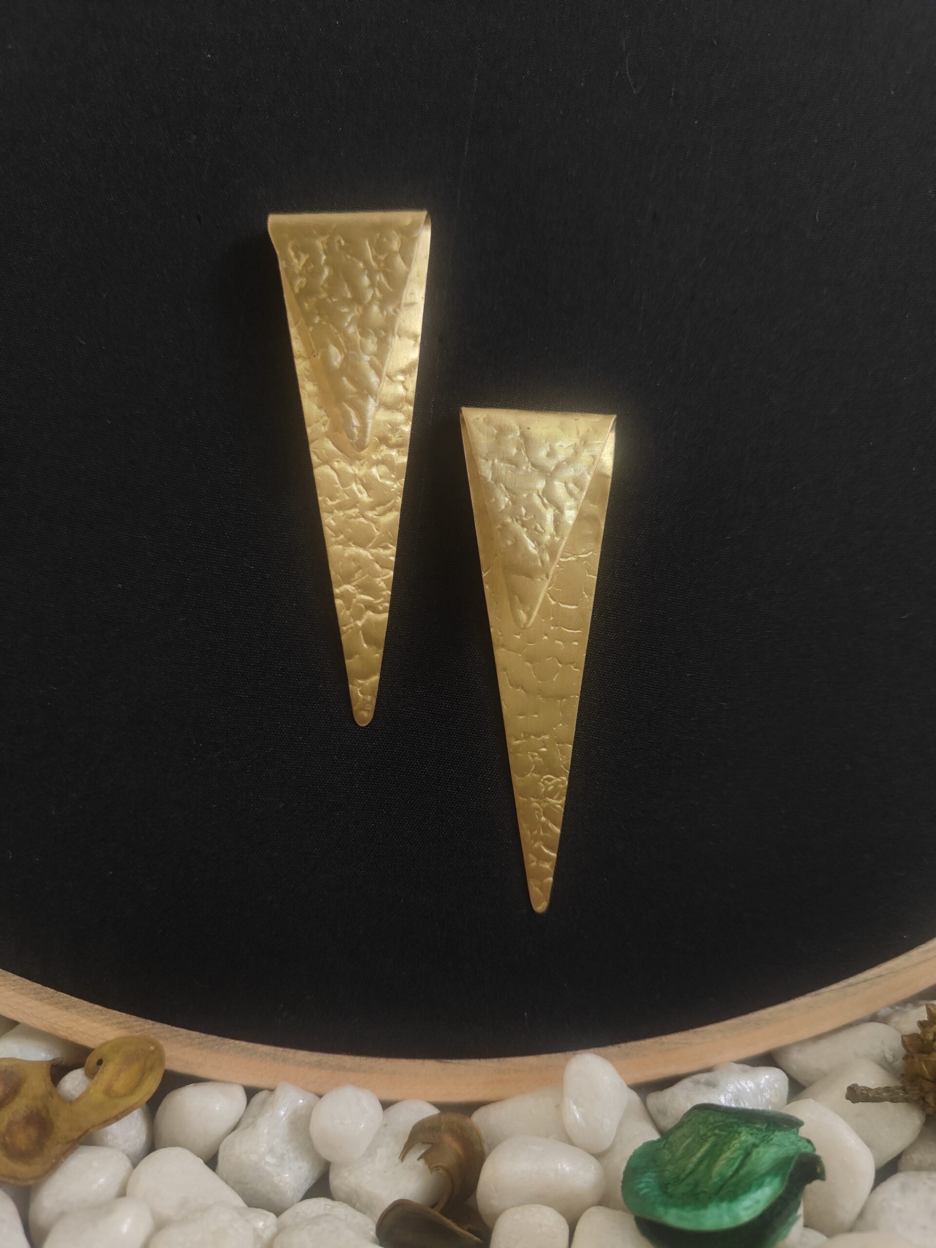sealed trikon earrings