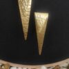 sealed trikon earrings