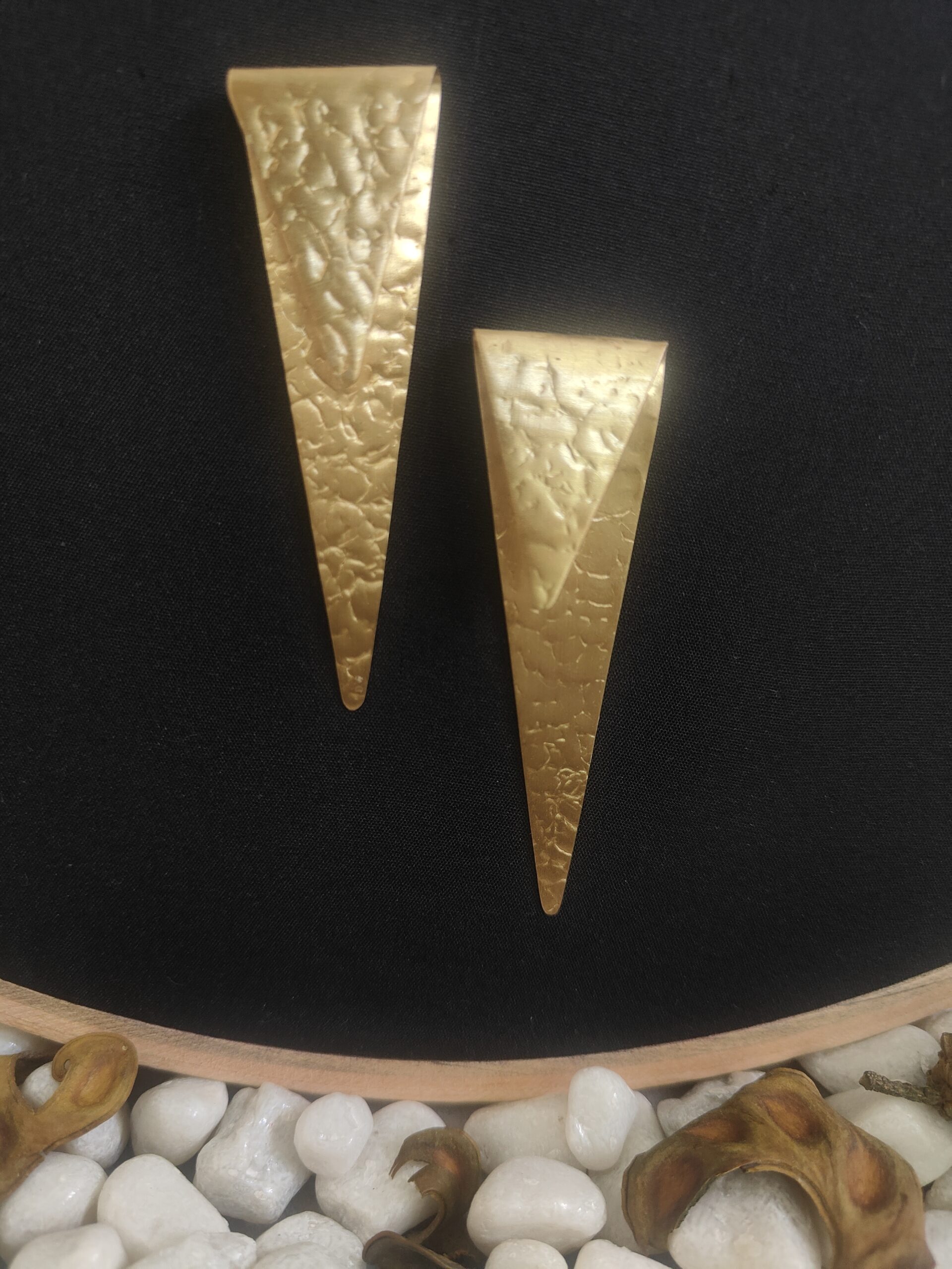 sealed trikon earrings