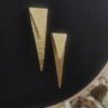 sealed trikon earrings