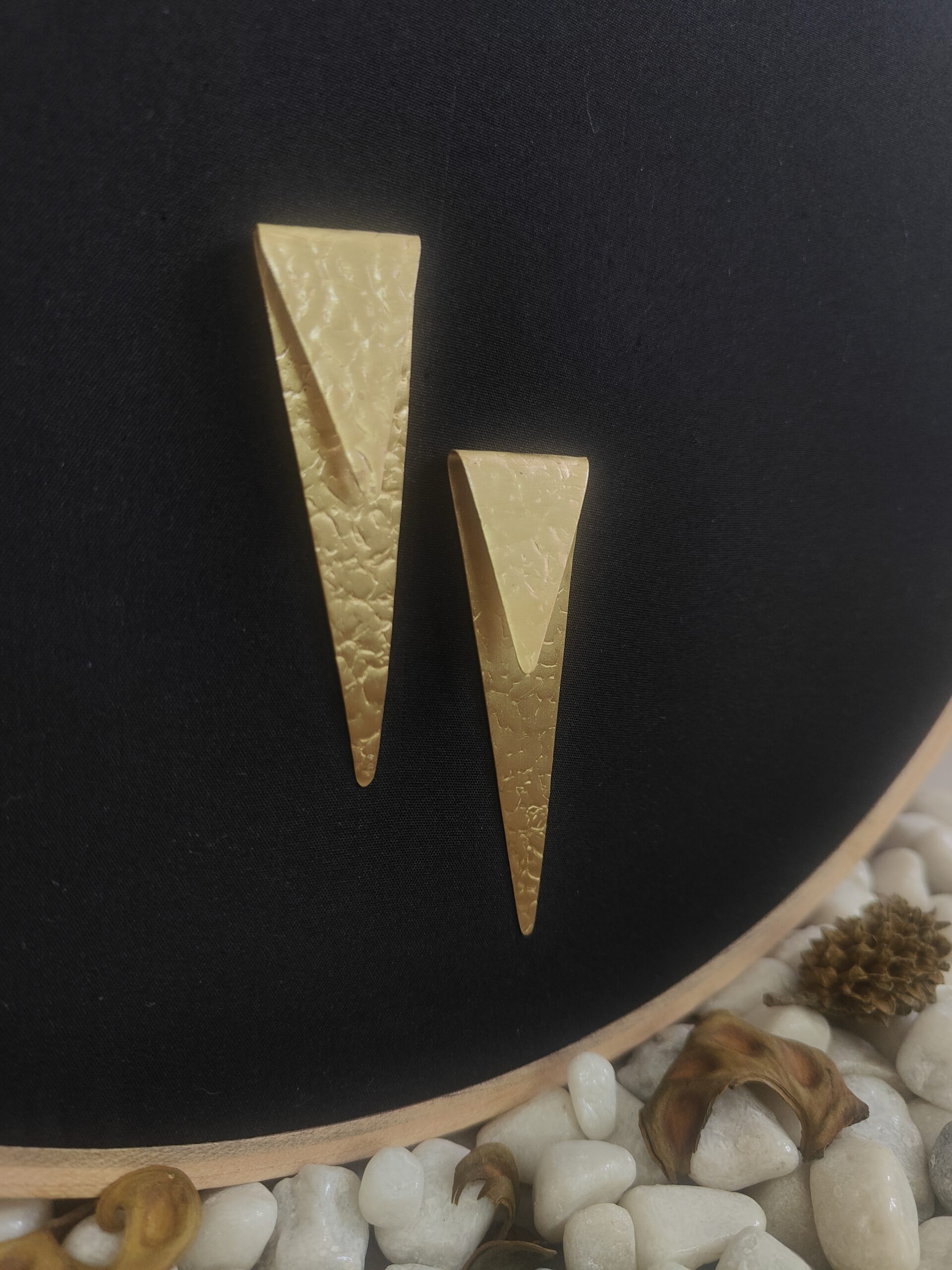 sealed trikon earrings