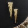 sealed trikon earrings