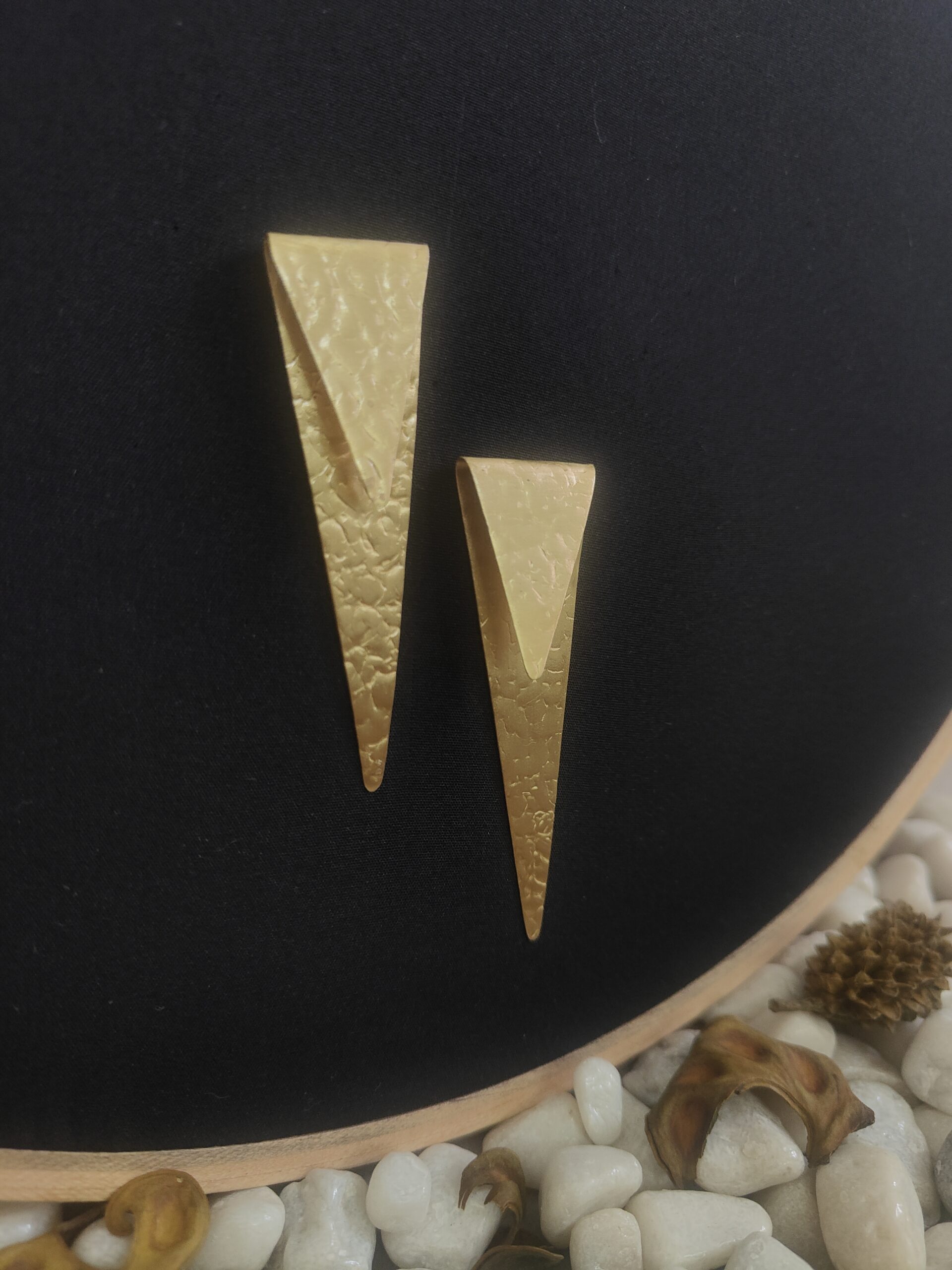 sealed trikon earrings